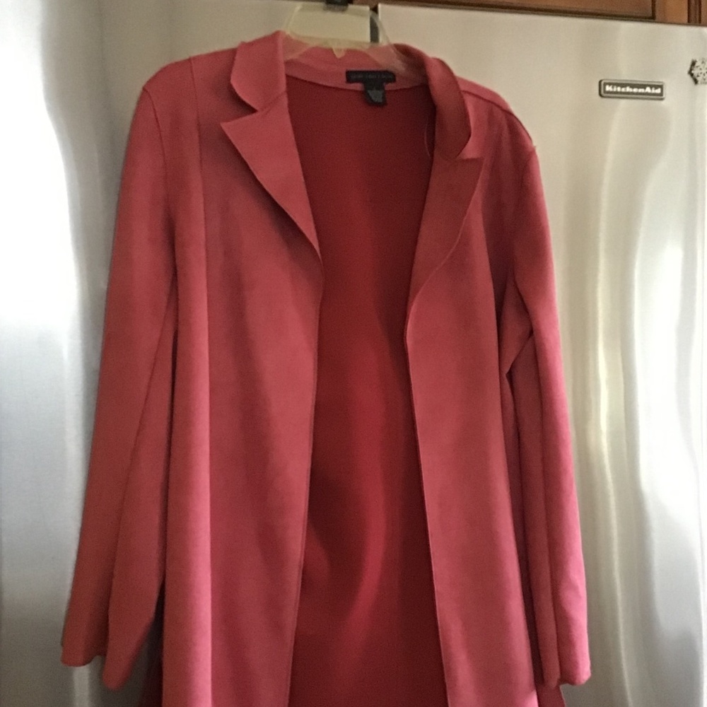 Woman’s long faux leather coat/jacket. Light weight.